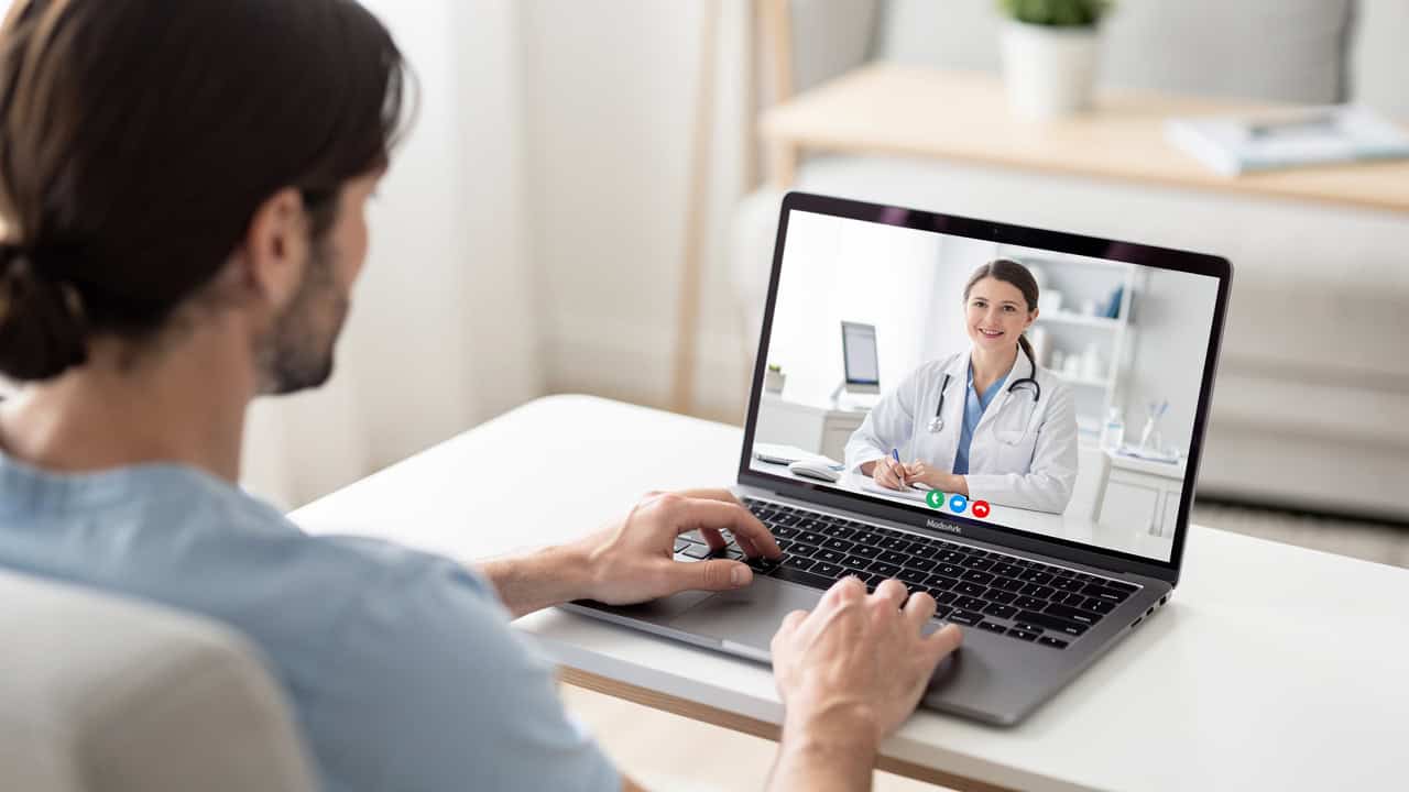 A patient speaks by video with a Pathology Consultation Expert about confusing report language.
