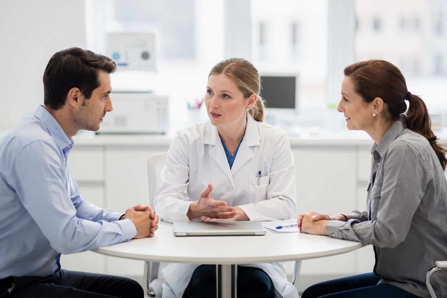 Specialist pathologist consultation helps a patient and doctor review biopsy results with clarity.