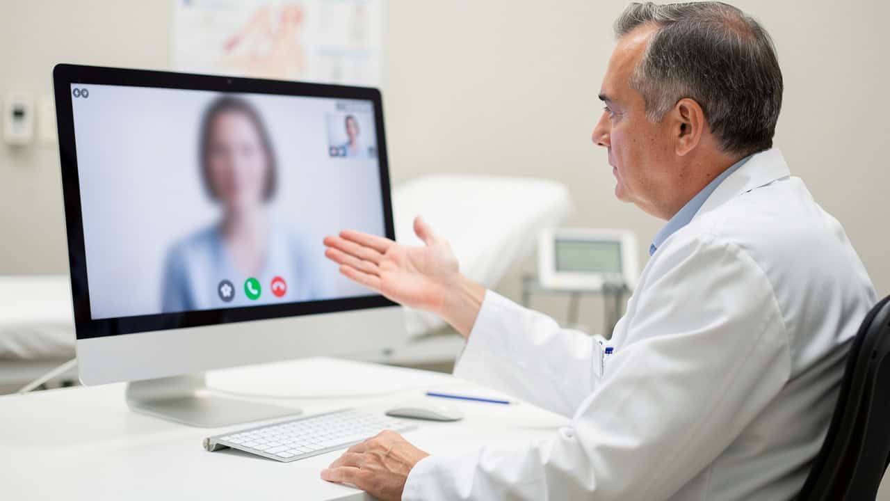 Urgent pathology consultation explained during a calm telemedicine video visit.