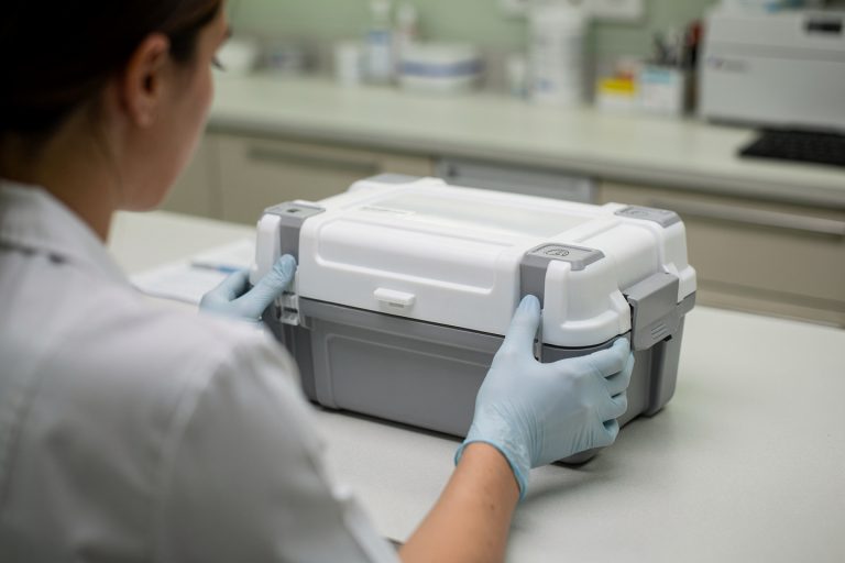 Close-up of a sealed pathology transport box representing pathology consultation results and next steps.